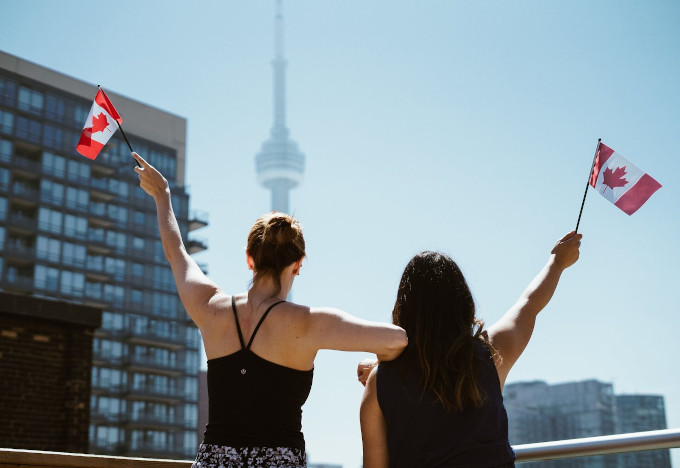 Image of students with Canadian flags