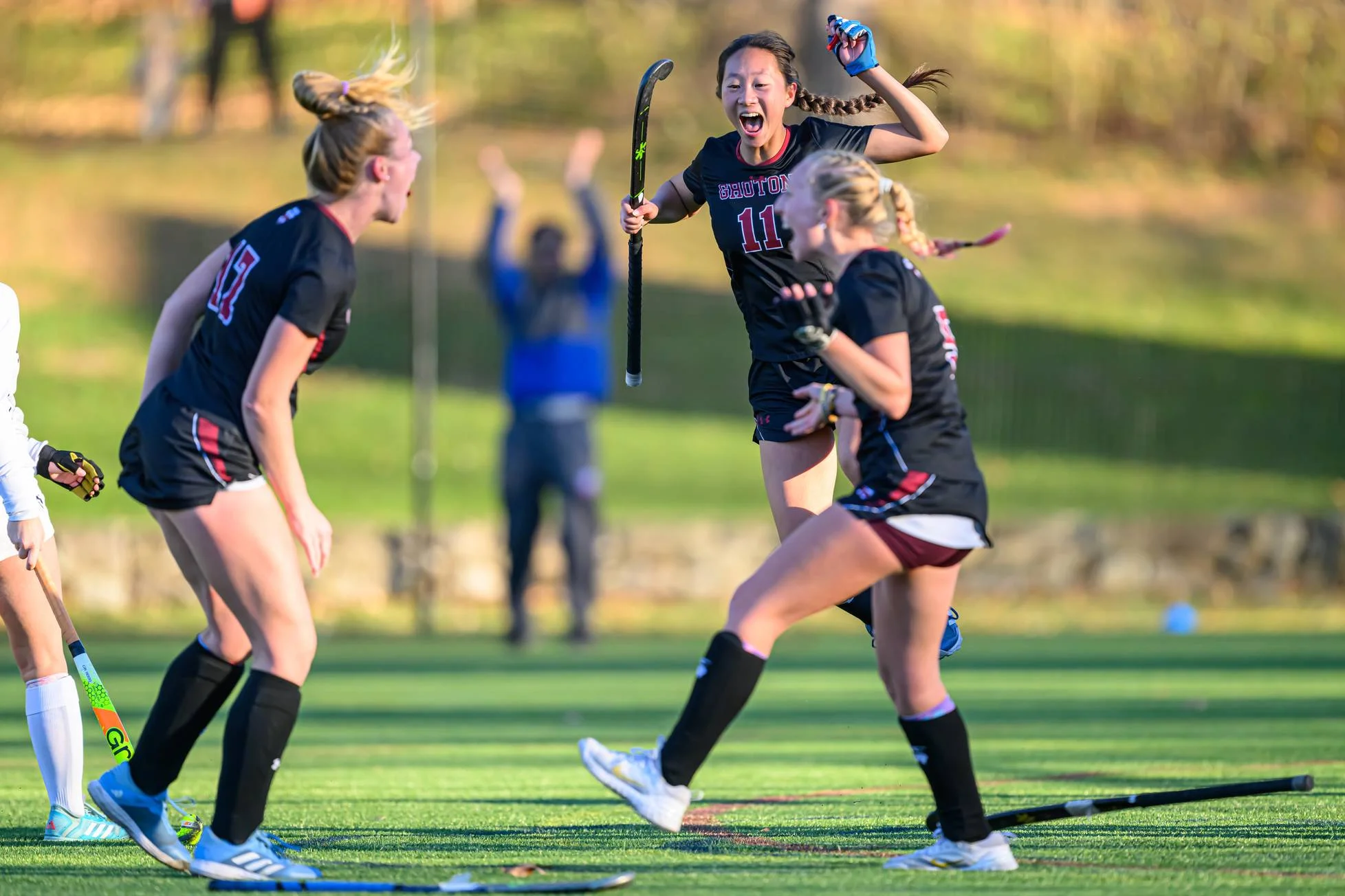 Estudiantes practicando hockey en Groton School